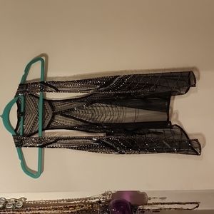 Beaded sheer vest.
